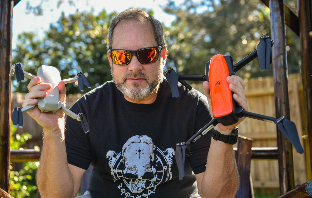 Having been a lifelong indie film fan, it was only natural for my years of practical work in technology to intersect with my passion for indie film production with the introduction and rapid growth of drones. I have been a tech instructor and writer for more than 15 years for national news and education platforms, specializing on drones and aerial cinematography most recently as the industry grows and evolves.  I live and work from home-base here in the Orlando, Florida area as owner of Black Dog Drone Operations where I am a FAA 14 CFR Part 107 Remote Pilot. I also work with the FAA Safety Team as Drone Pro, providing support, education and guidance to drone operators of all levels.  As a Film Florida member I provide aerial cinematography for indie productions such as film and music videos. My passion for aerial cinematography and the opportunity to work with indie filmmakers is a perfect mix that I enjoy sharing with filmmakers everywhere.  I am thrilled to bring all of my experience and resources to Romero Pictures Indie Brigade Drone Cav! This is a great place to share tons of great info on the rapidly growing and evolving world of drones. We are promoting lots of discussions about different models and cameras, flying techniques as well as plenty of tips and tricks. Learning more about he software, digging into camera settings, safety, FAA and regulations and so many topics will go a long ways to making you a better flying filmmaker. We want to help you learn to fly like an aerial filmmaker with the unique platforms aerial cinematography can offer to raise production value while lowering the budget.